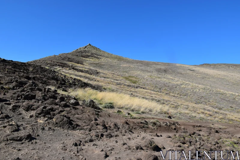 Mountain Peak in Barren Terrain Free Stock Photo