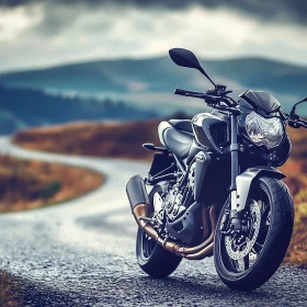 Black Motorcycle on Winding Road