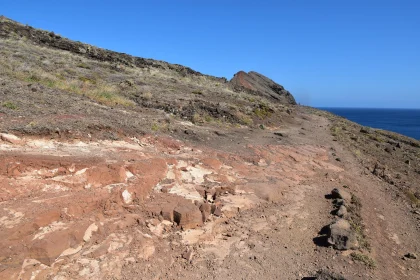 Rocky Coastal Trail under Blue Skies