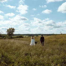 Wedding Day Bliss in Grassy Field