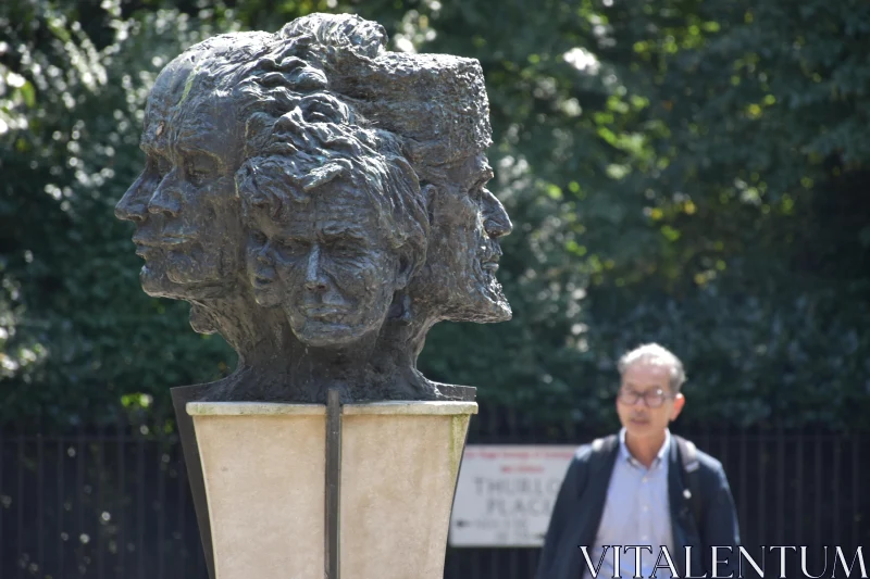 Sculpture of Multiple Faces Outdoors Free Stock Photo