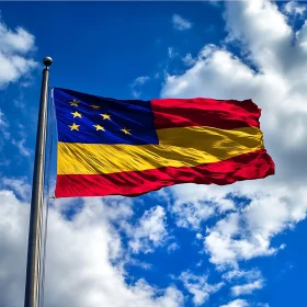 Red, Blue, and Yellow Flag Against Sky