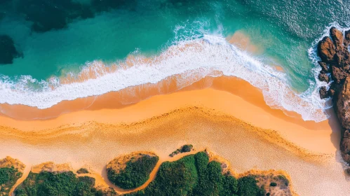 Aerial Shot of Sea Waves Crashing on Sandy Beach