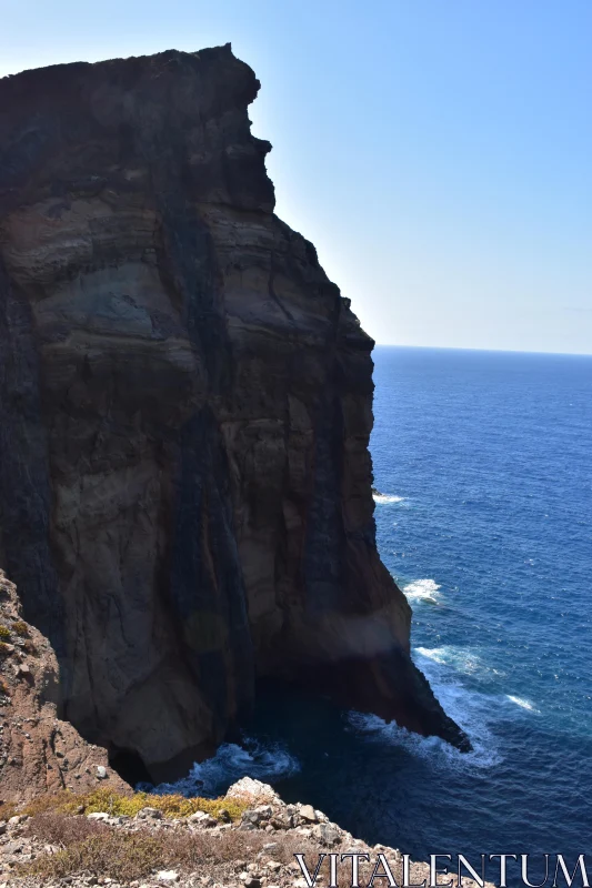 Coastal Cliff with Crashing Waves Free Stock Photo