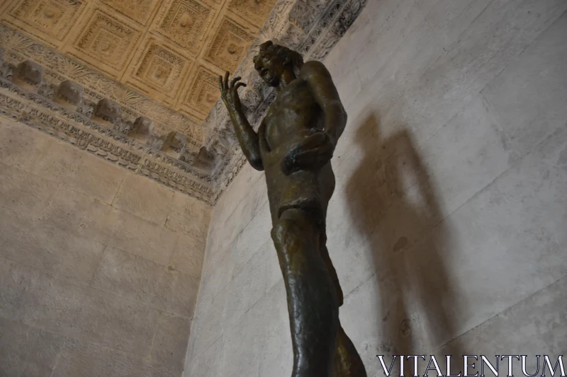 PHOTO Bronze Figure with Architectural Shadow