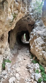 Rugged Cave Pathway Illuminated by Natural Light