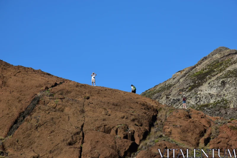 Hikers on a Red Mountain Free Stock Photo