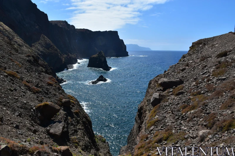 Rugged Cliffs Overlooking the Blue Sea Free Stock Photo