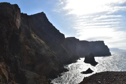 Rugged Cliffs by Sunlit Sea