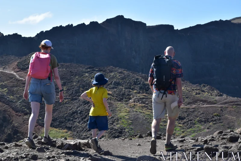 PHOTO Family Trekking in Rugged Mountain Terrain