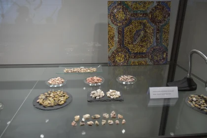 Museum Showcase of Mosaic Stones and Art Piece