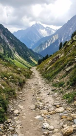 Majestic Mountain Path Leading Through Green Valley