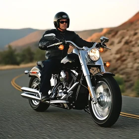 Man on Motorcycle on Winding Road