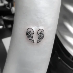 Delicate Black Ink Angel Wings on Inner Arm