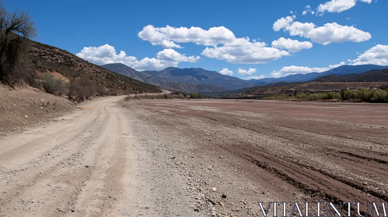 Mountain Road Under Blue Sky AI Image