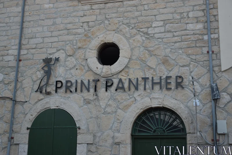 PHOTO Rustic Signage on Stone Building