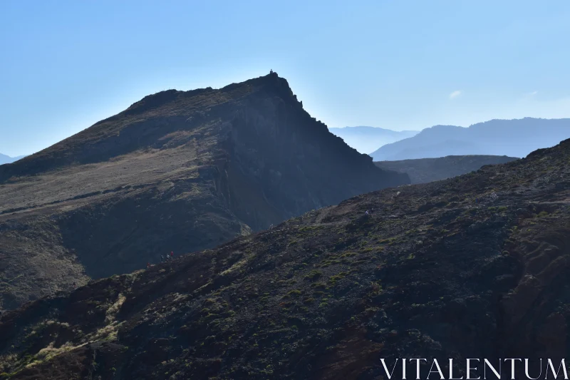 PHOTO Rugged Mountain Cliffs in Sunlight