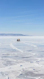 Captivating Nature Photography: A Man on an Empty Ice Sled in Desolate Landscapes