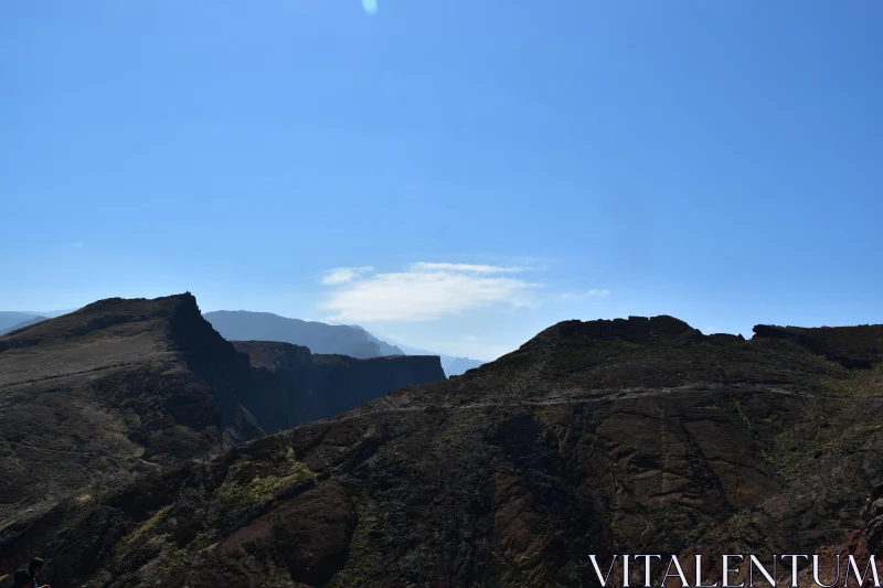 PHOTO Rugged Landscape with Blue Sky Horizon