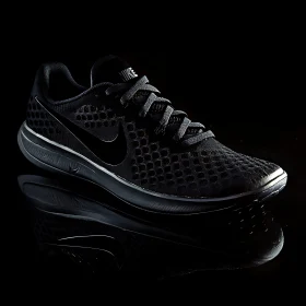 Monochrome Nike Sneaker on Reflective Surface