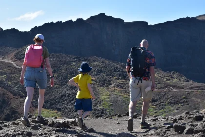 Family Trekking in Rugged Mountain Terrain