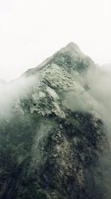 Enigmatic Mountain Peak with Fog