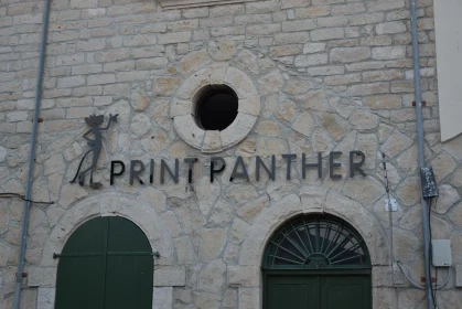 Rustic Signage on Stone Building