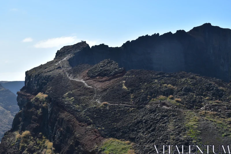 Cliffside Adventure in Volcanic Terrain Free Stock Photo