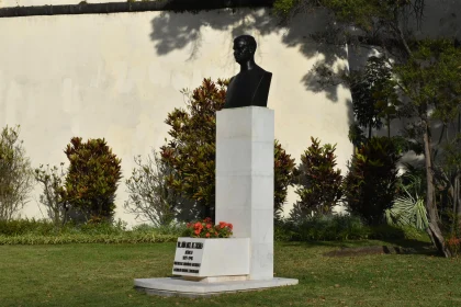 Bronze Bust Monument Amidst Greenery