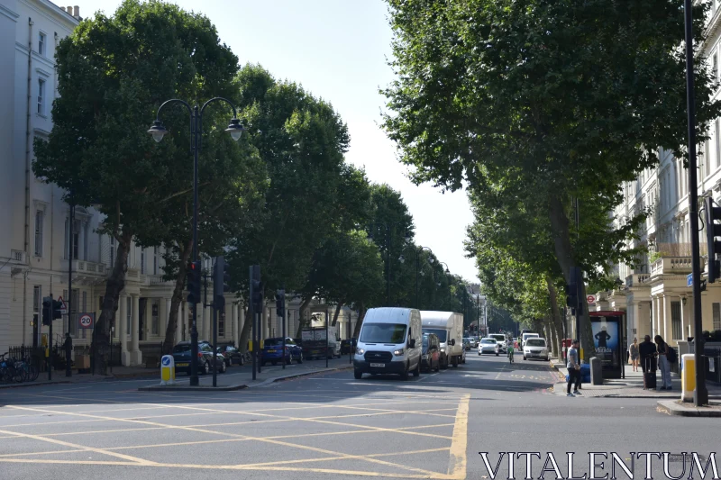 City Road with Vehicles and Pedestrians Free Stock Photo