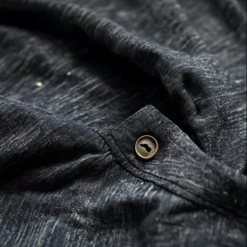 Close-Up of Garment Fabric and Button