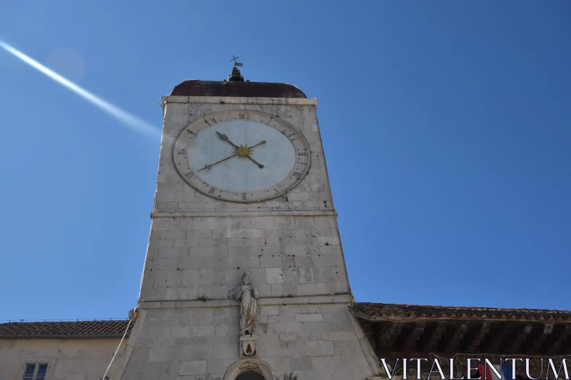 Ancient Clock Tower under Sunlit Sky Free Stock Photo