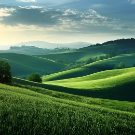 Lush Green Hills Under Cloudy Sky