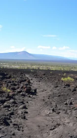 Black Volcanic Lava Trail in Expansive Landscapes