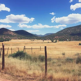 Scenic Landscape with Field and Mountains