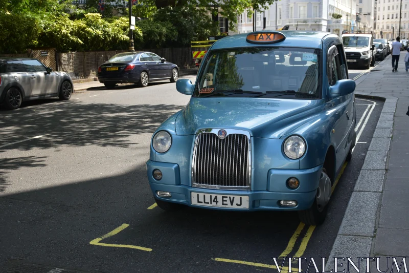 Blue London Taxi in Urban Scene Free Stock Photo