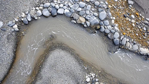 Curving Stream with Pebble-Lined Banks