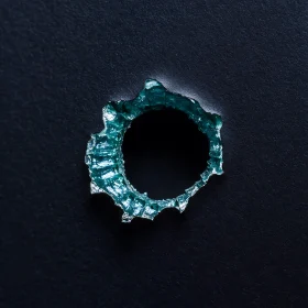 Teal-Edged Circular Hole on Dark Background