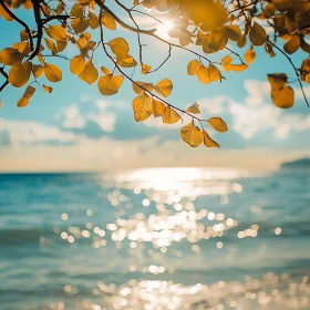 Sunlit Sea Framed by Golden Leaves