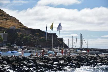 Sunlit Beach and Sailboats in Madeira, Portugal Free Stock Photo