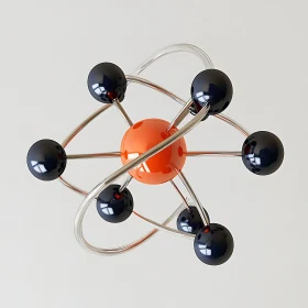 Atomic Model with Orange Center and Electron Paths