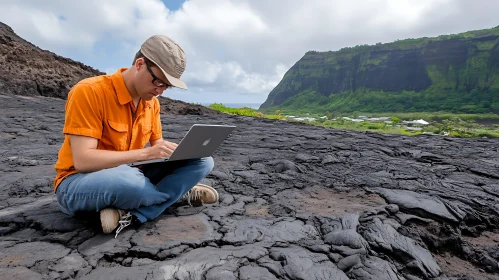 Man Coding on Volcanic Rock