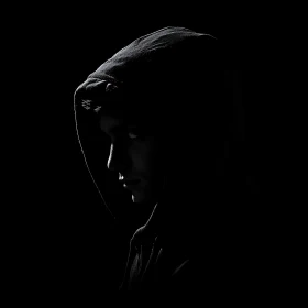 Hooded Figure in Shadow