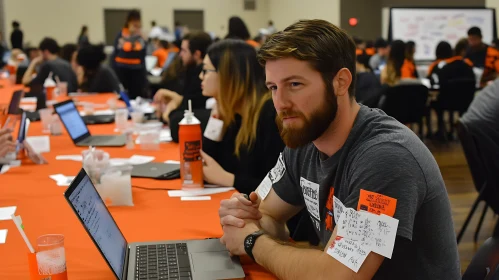 Man Attending a Conference with Computer