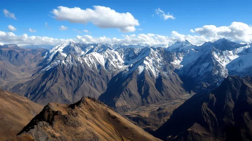 Snowy Mountain Peaks Under Blue Sky