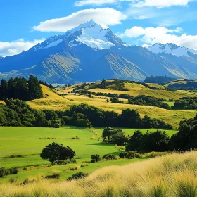 Snow-Capped Mountain Over Lush Green Valley