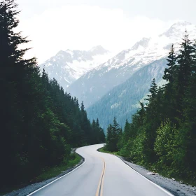 Winding Road to Snowy Peaks