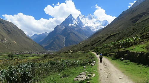 Hikers in Mountain Valley Landscape