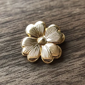 Intricately Designed Gold Flower-Shaped Pin