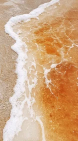 Tranquil Beach Scene with Gentle Waves and Sandy Shore